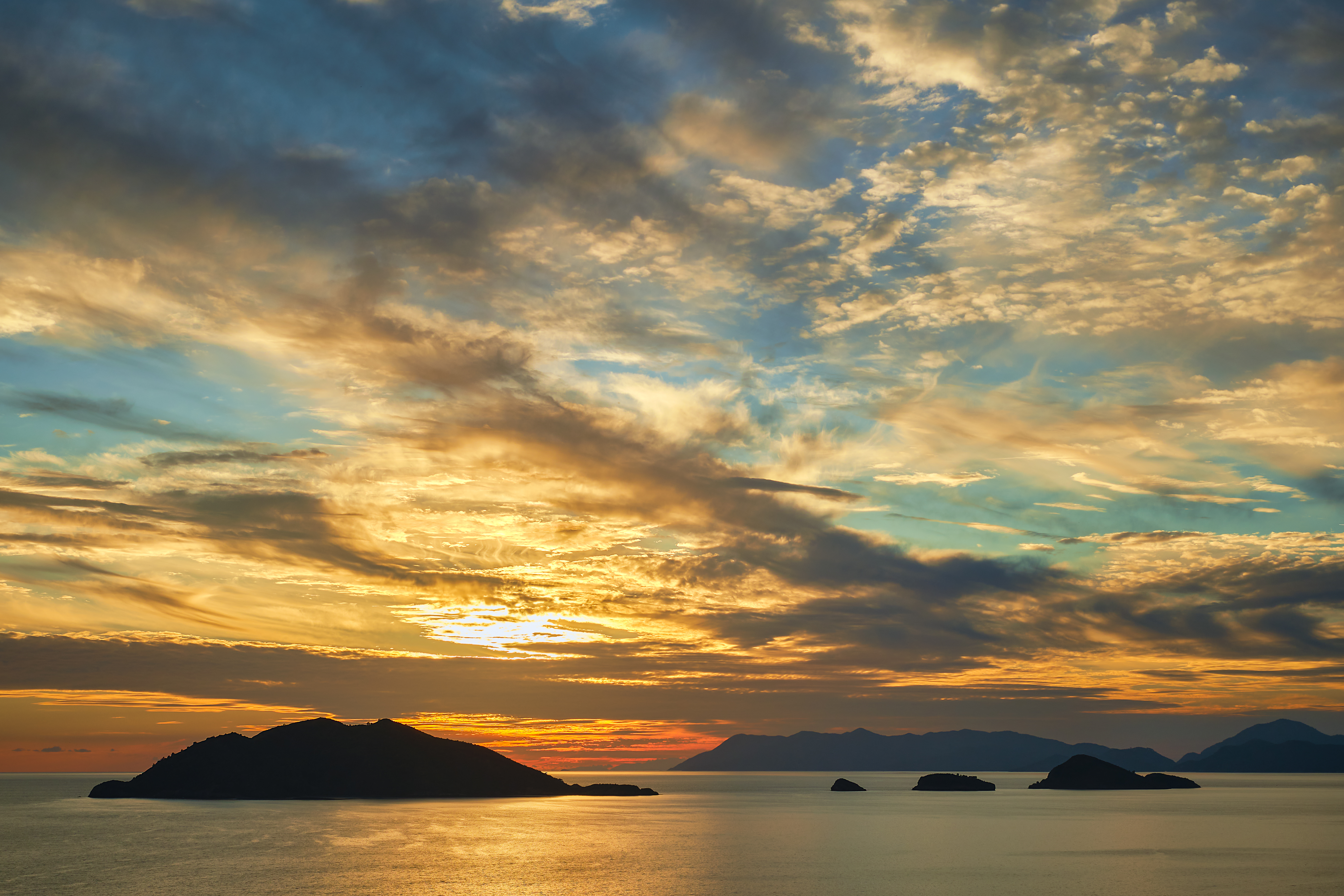 Beautiful sunset sky with clouds over the sea